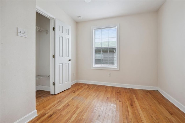 spare room with light hardwood / wood-style floors