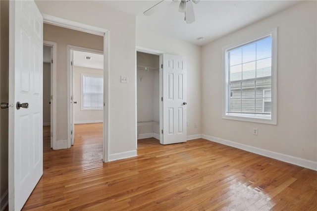 unfurnished bedroom with ceiling fan and light hardwood / wood-style floors