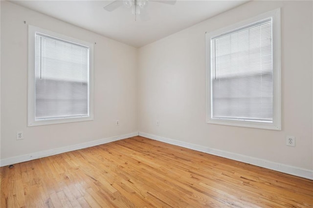 spare room featuring ceiling fan and light wood-type flooring