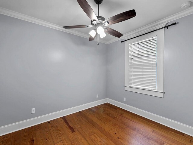 spare room featuring crown molding, ceiling fan, and hardwood / wood-style flooring