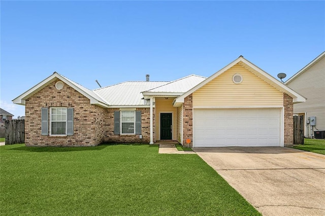 ranch-style home featuring concrete driveway, a front yard, brick siding, a garage, and metal roof