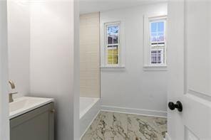 bathroom with independent shower and bath and vanity