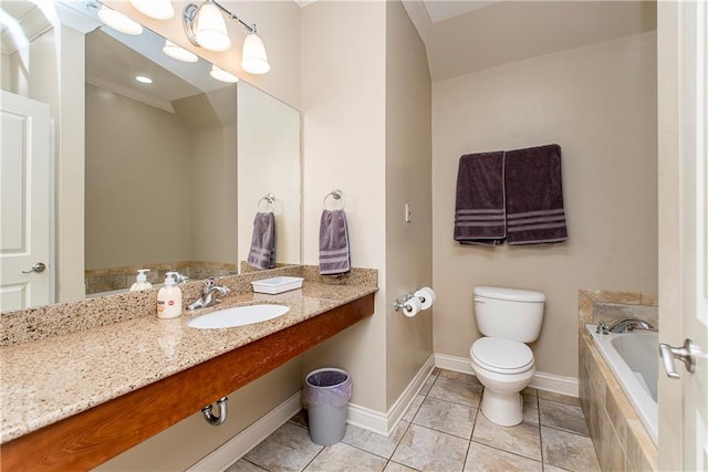 bathroom with tile patterned flooring, tiled tub, sink, and toilet