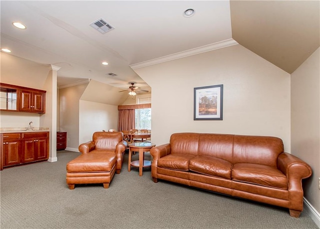 carpeted living room with lofted ceiling, ceiling fan, and crown molding