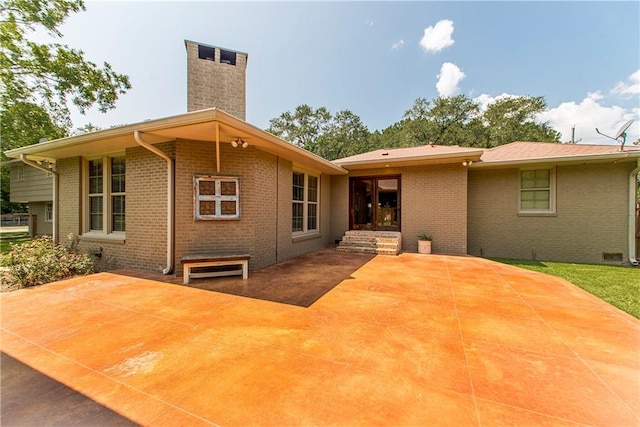 rear view of house featuring a patio