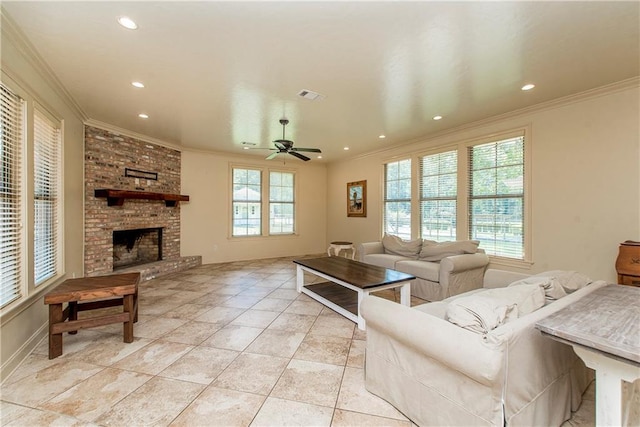 living room featuring crown molding, recessed lighting, a fireplace, and visible vents