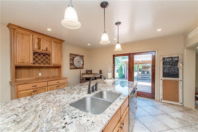 kitchen featuring a sink, dishwasher, and ornamental molding