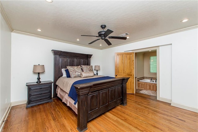 bedroom with visible vents, baseboards, ornamental molding, and light wood finished floors