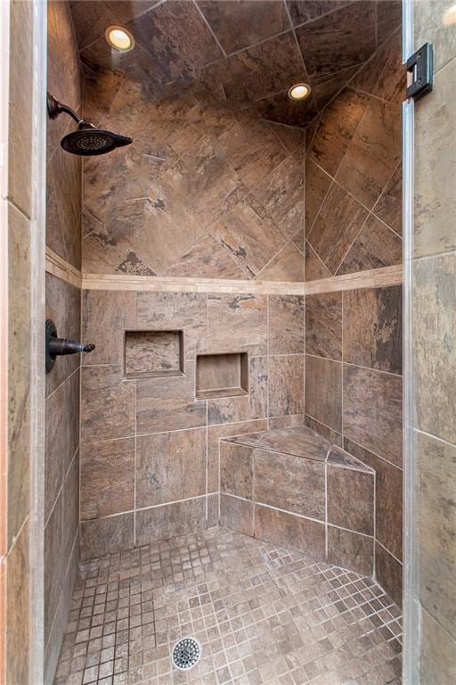 full bathroom with recessed lighting and a stall shower