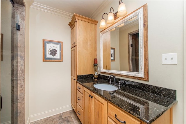 full bathroom featuring baseboards, vanity, walk in shower, and crown molding