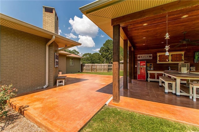 deck featuring a sink, a patio, ceiling fan, and fence