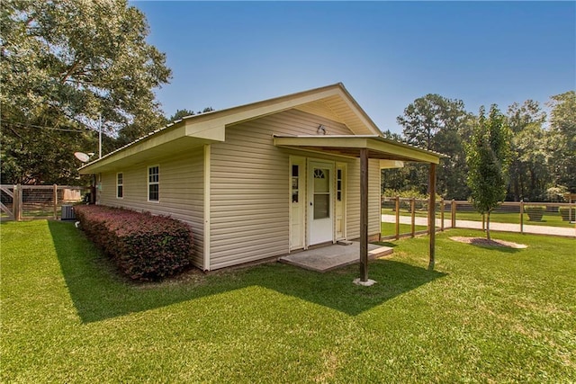 exterior space with a yard and fence