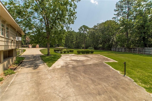 view of yard with cooling unit and fence