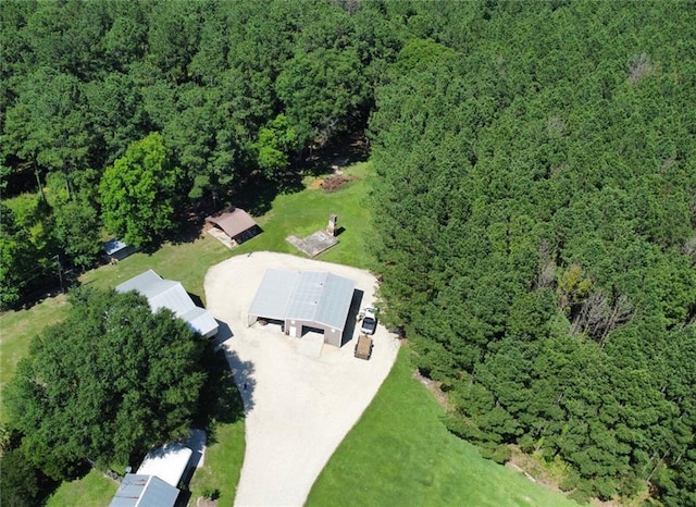 birds eye view of property featuring a wooded view