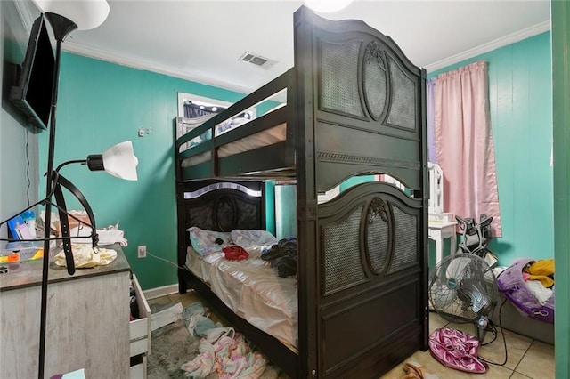 tiled bedroom with ornamental molding