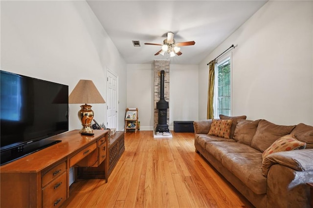 living room featuring ceiling fan and light wood-type flooring