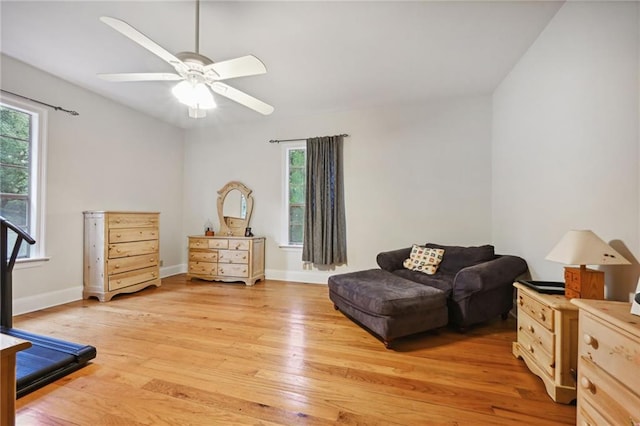 sitting room with ceiling fan and light hardwood / wood-style floors