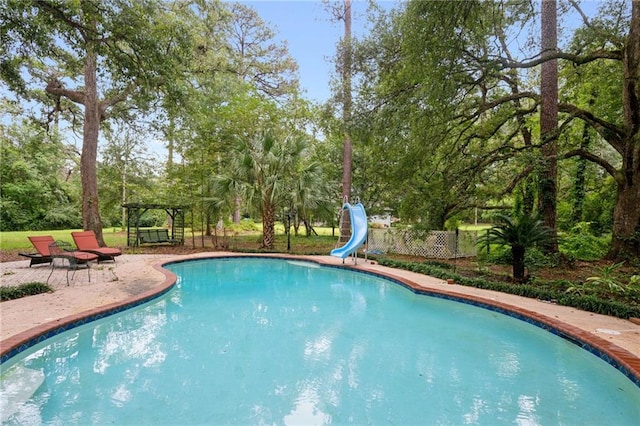 view of pool featuring a water slide