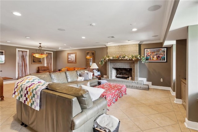 living room featuring a fireplace, crown molding, and light tile patterned floors