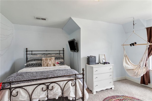 carpeted bedroom featuring vaulted ceiling