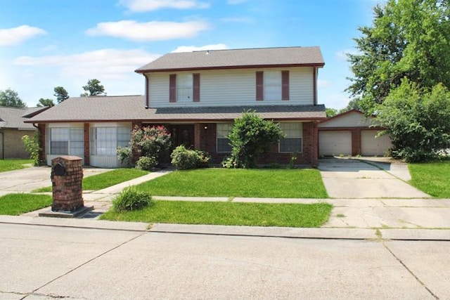 view of front property with a garage and a front yard