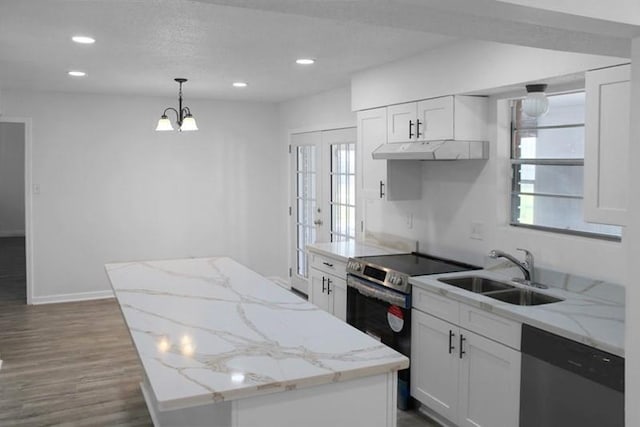 kitchen featuring pendant lighting, sink, dark wood-type flooring, appliances with stainless steel finishes, and white cabinets