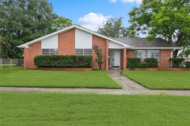 ranch-style home featuring a front yard