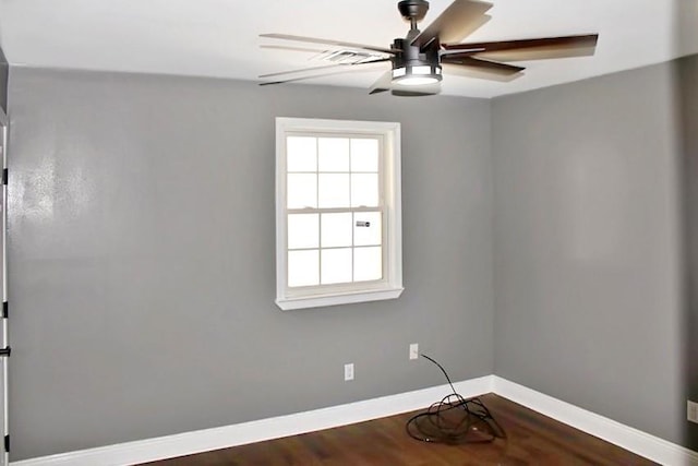 spare room featuring hardwood / wood-style flooring, a wealth of natural light, and ceiling fan