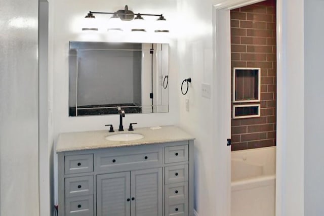 bathroom with a bathing tub and vanity