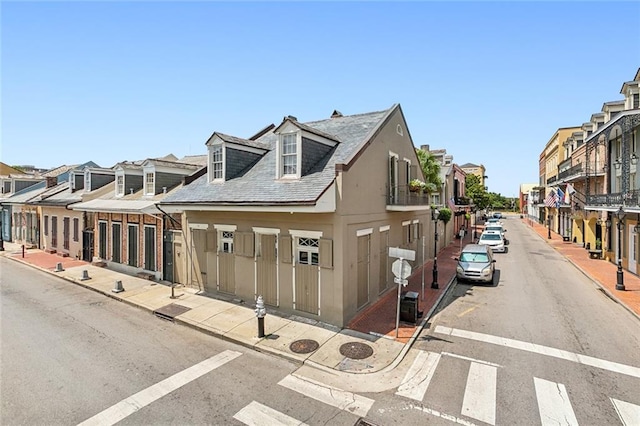 view of street featuring a residential view, curbs, and sidewalks