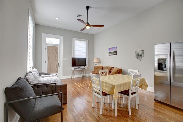 dining space featuring ceiling fan and light hardwood / wood-style flooring