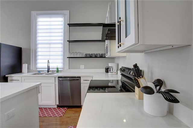 kitchen featuring dark wood-type flooring, white cabinets, appliances with stainless steel finishes, and sink