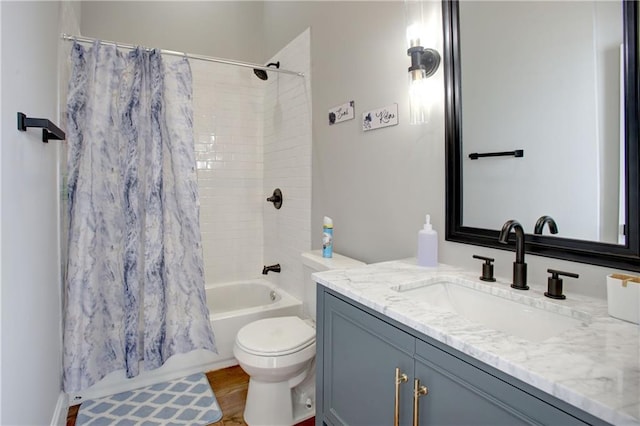 full bathroom with shower / bath combo with shower curtain, toilet, hardwood / wood-style flooring, and vanity