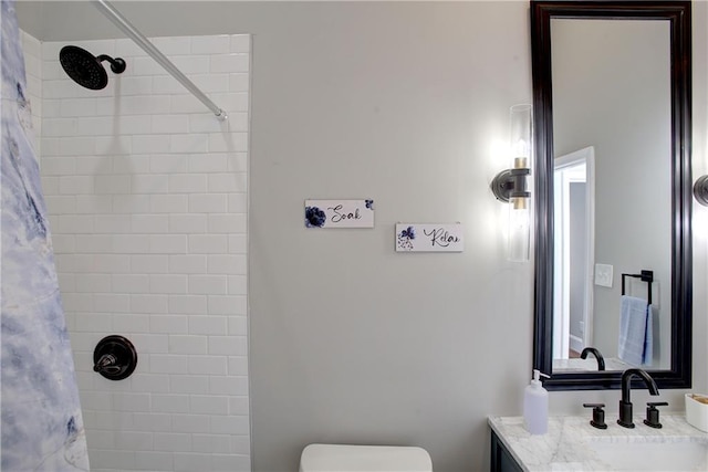 bathroom featuring a shower with shower curtain, toilet, and vanity