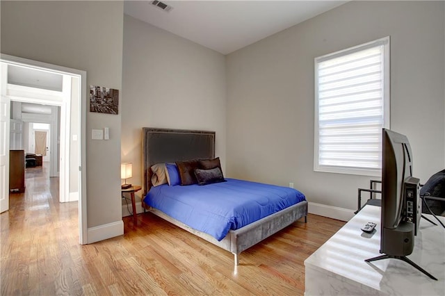 bedroom with light hardwood / wood-style floors