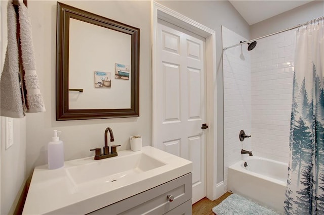 bathroom featuring hardwood / wood-style floors, shower / tub combo, and vanity