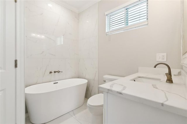 bathroom with tile walls, a tub, toilet, and vanity