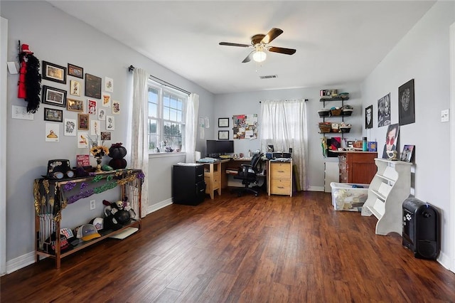 office area with ceiling fan and dark hardwood / wood-style floors