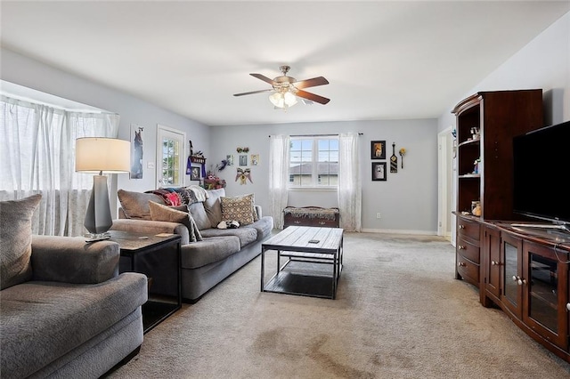 living room featuring ceiling fan and light colored carpet