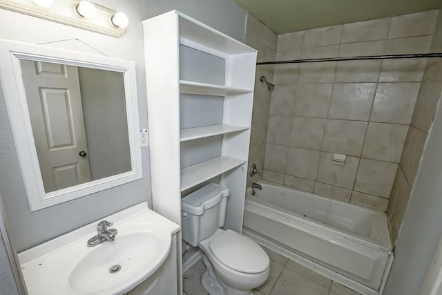 full bathroom featuring tile patterned floors, vanity, toilet, and tiled shower / bath combo