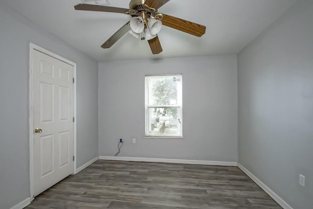 empty room featuring ceiling fan and hardwood / wood-style floors