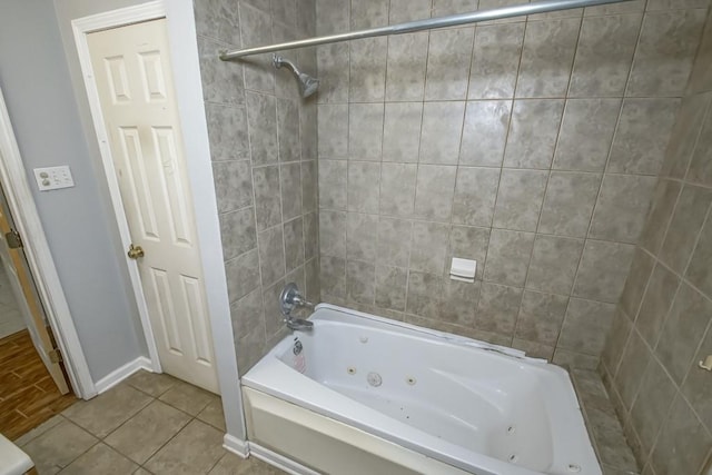 bathroom with tile patterned flooring and tiled shower / bath