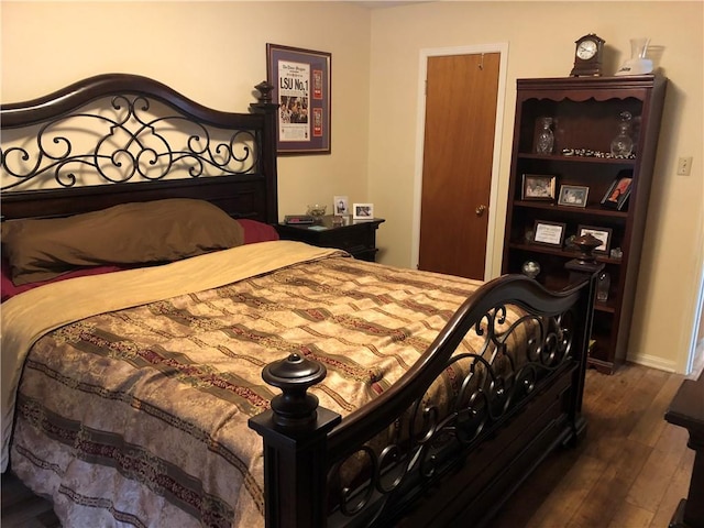 bedroom featuring dark hardwood / wood-style floors