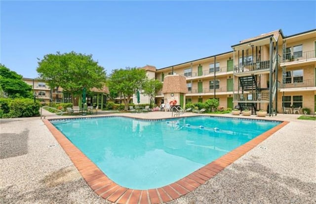 view of pool featuring a patio area