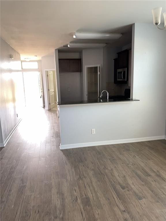 interior space with dark hardwood / wood-style floors and sink