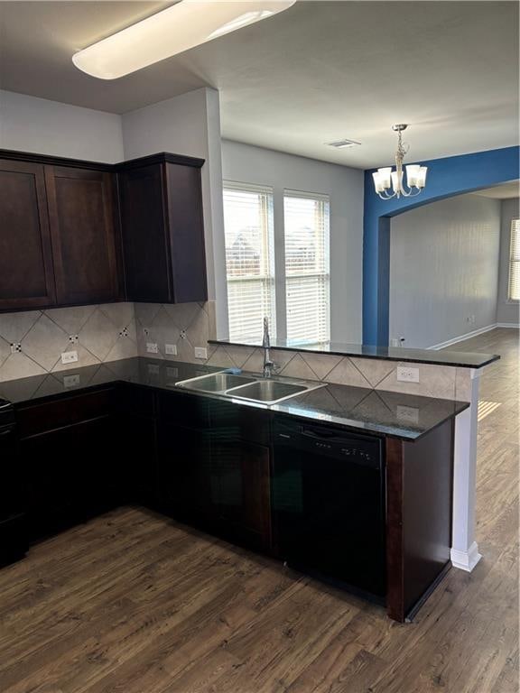 kitchen featuring dishwasher, dark hardwood / wood-style floors, and tasteful backsplash