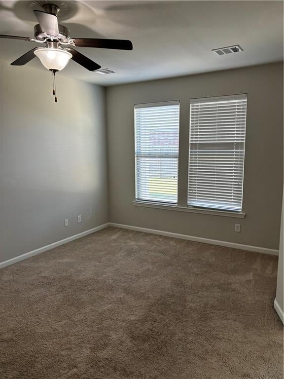 empty room with carpet and ceiling fan