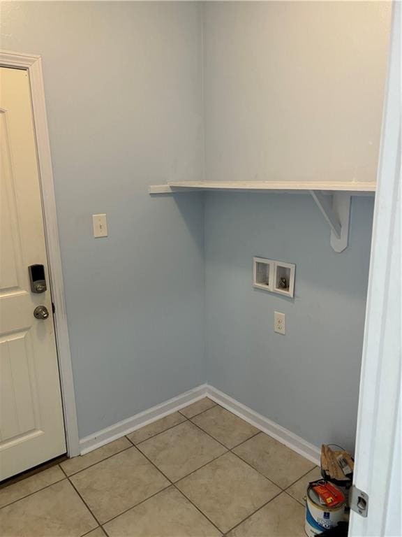 laundry area with hookup for a washing machine and light tile patterned flooring