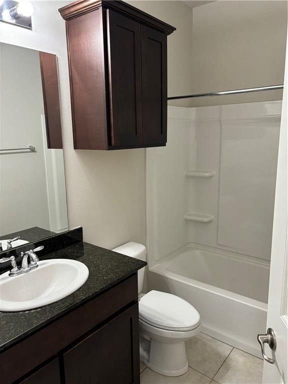 full bathroom featuring tile patterned flooring, vanity, toilet, and shower / bath combination