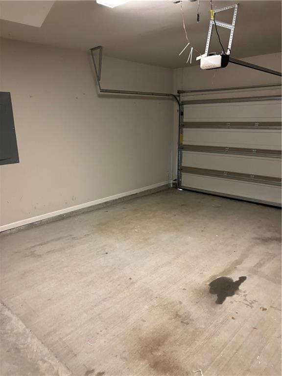 garage featuring a garage door opener and electric panel